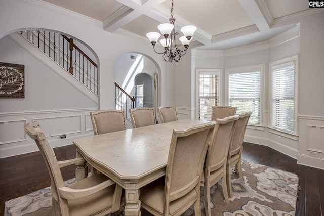 dining space with ornamental molding, a notable chandelier, arched walkways, and beam ceiling