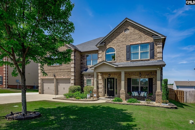 view of front of home with fence, an attached garage, brick siding, and driveway