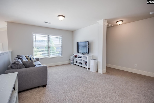 living area featuring light carpet, baseboards, and visible vents
