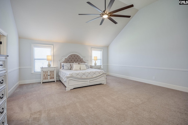 carpeted bedroom with lofted ceiling, baseboards, and multiple windows