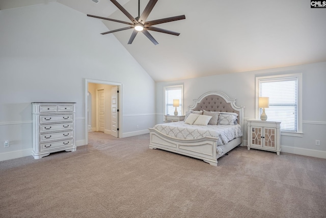 carpeted bedroom with baseboards, high vaulted ceiling, and a ceiling fan