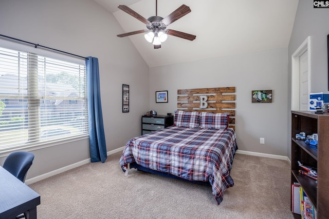 carpeted bedroom featuring baseboards, ceiling fan, and high vaulted ceiling