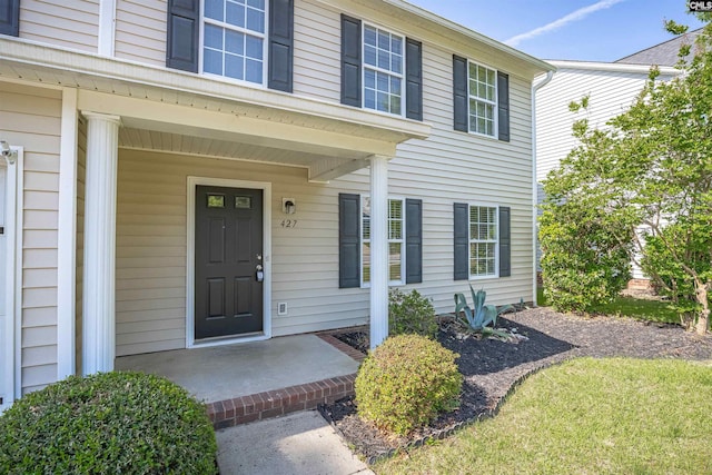 doorway to property featuring covered porch