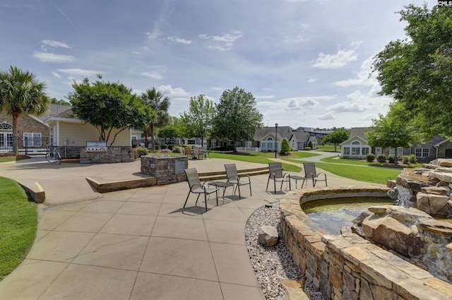 surrounding community featuring a lawn and a residential view