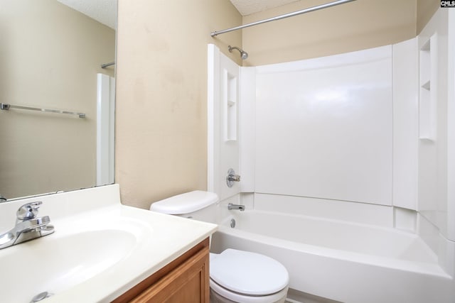 full bath with vanity, toilet, a textured ceiling, and shower / bathtub combination