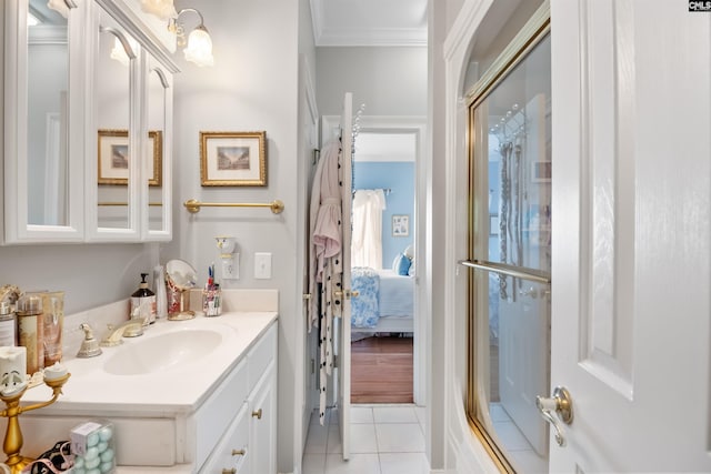 bathroom with tile patterned floors, crown molding, ensuite bathroom, and vanity