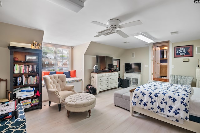 bedroom with ceiling fan, light wood-style flooring, and visible vents