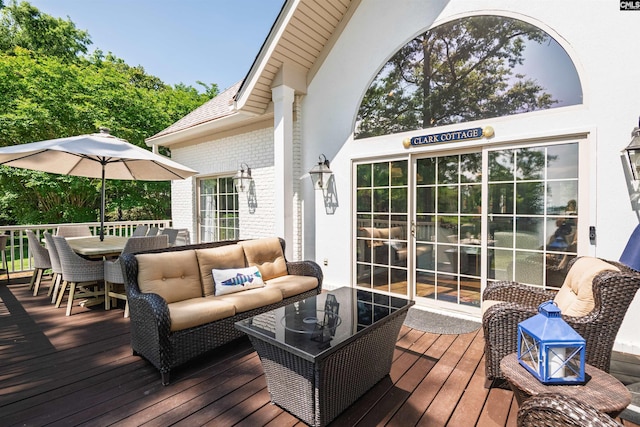 deck featuring an outdoor hangout area and outdoor dining space