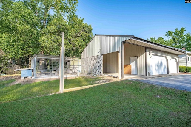 exterior space featuring driveway and fence
