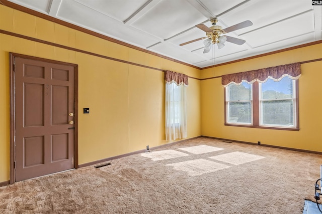 spare room featuring a ceiling fan, baseboards, visible vents, and carpet