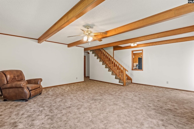 unfurnished room with baseboards, stairway, beam ceiling, and carpet