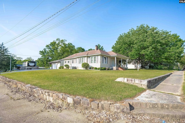 single story home featuring a chimney and a front yard