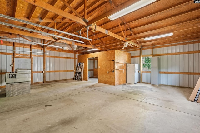 garage with freestanding refrigerator