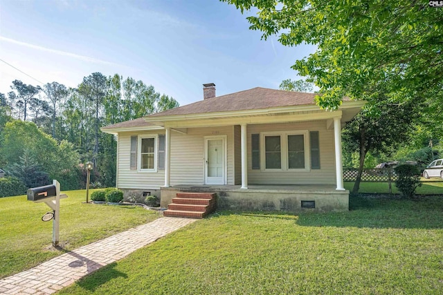 bungalow with a front lawn, a porch, crawl space, and a chimney