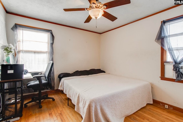 2700 Magnolia St, Columbia, SC 29204 - bedroom featuring a ceiling fan, ornamental molding, and light wood-type flooring