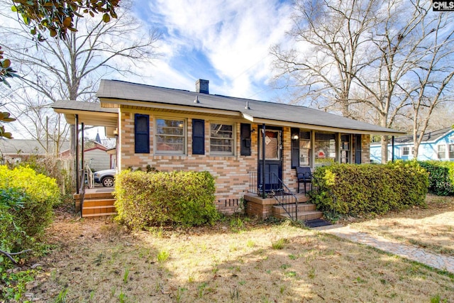 2700 Magnolia St, Columbia, SC 29204 - view of front of home featuring a chimney and brick siding