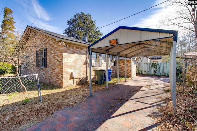2700 Magnolia St, Columbia, SC 29204 - view of patio / terrace with a detached carport, fence, cooling unit, and driveway