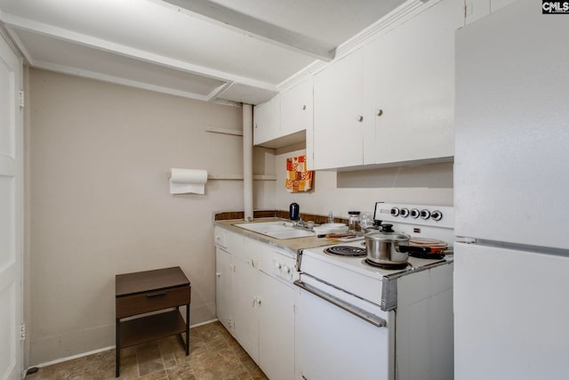 2700 Magnolia St, Columbia, SC 29204 - kitchen featuring a sink, white appliances, light countertops, and white cabinets