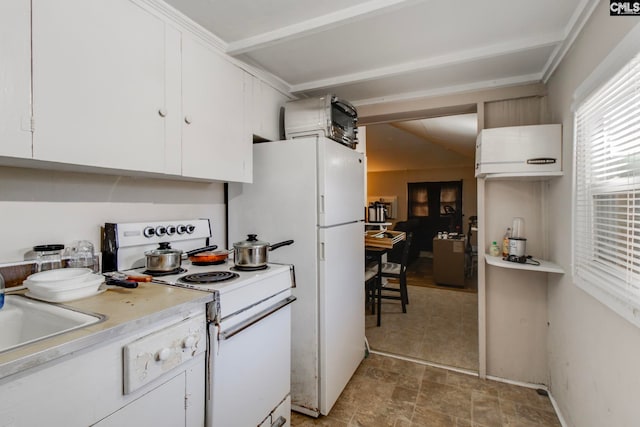 2700 Magnolia St, Columbia, SC 29204 - kitchen with a sink, white cabinetry, white electric range oven, light countertops, and stone finish flooring