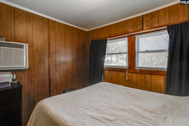 2700 Magnolia St, Columbia, SC 29204 - bedroom featuring ornamental molding, a textured ceiling, an AC wall unit, and wood walls
