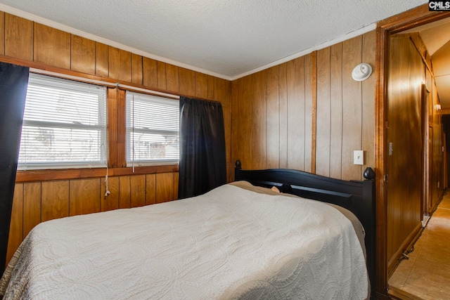 2700 Magnolia St, Columbia, SC 29204 - bedroom featuring a textured ceiling, wood walls, and ornamental molding
