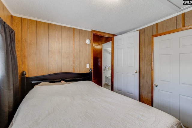 2700 Magnolia St, Columbia, SC 29204 - bedroom featuring wood walls and a textured ceiling