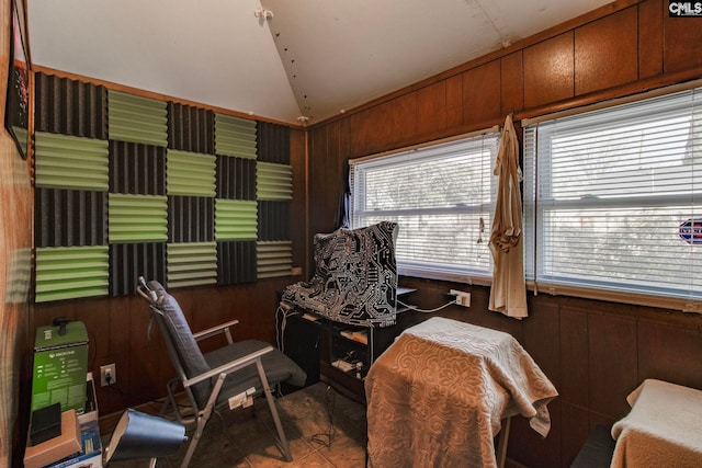 2700 Magnolia St, Columbia, SC 29204 - living area with lofted ceiling, tile patterned floors, and wood walls