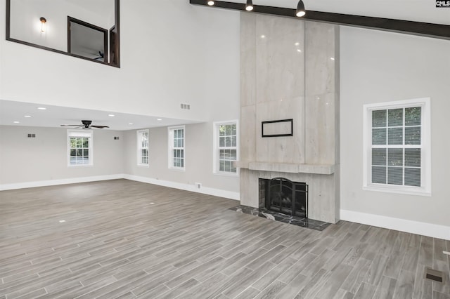 15 Glenlake Rd, Columbia, SC 29223 - unfurnished living room featuring a fireplace, ceiling fan, baseboards, and high vaulted ceiling