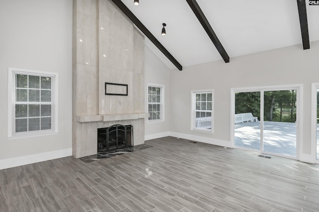 15 Glenlake Rd, Columbia, SC 29223 - unfurnished living room featuring a high end fireplace, baseboards, beamed ceiling, and high vaulted ceiling