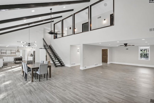 15 Glenlake Rd, Columbia, SC 29223 - dining space featuring high vaulted ceiling, baseboards, a ceiling fan, and stairs