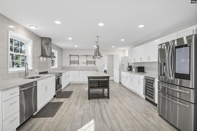 15 Glenlake Rd, Columbia, SC 29223 - kitchen with wine cooler, a sink, white cabinetry, wall chimney range hood, and appliances with stainless steel finishes