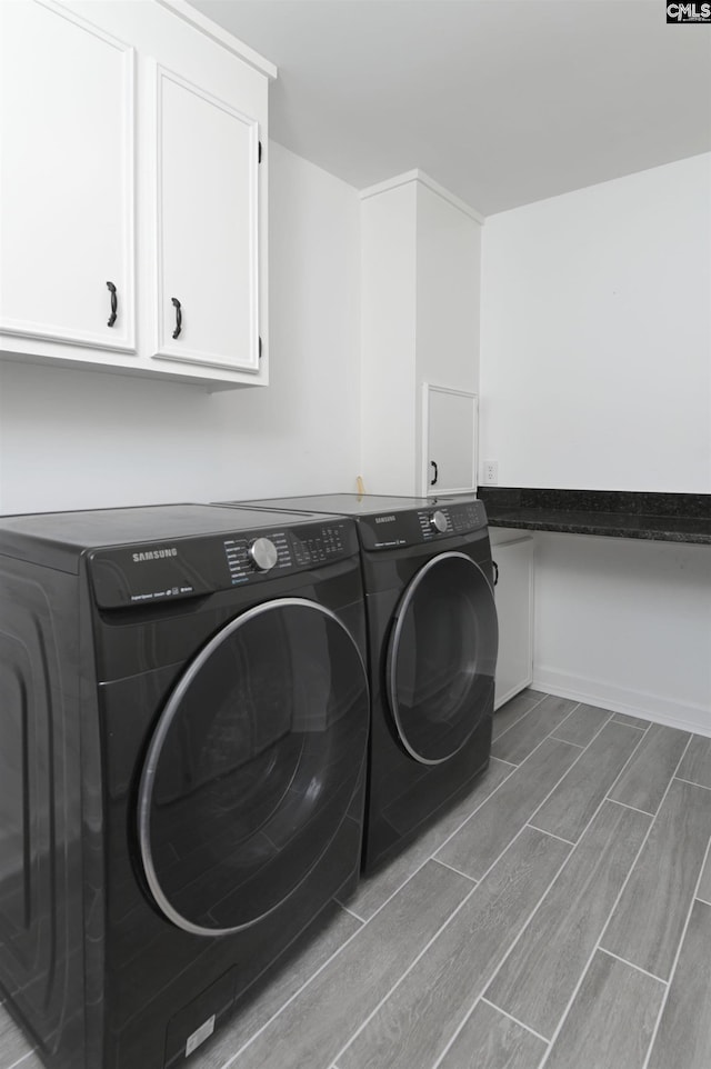 15 Glenlake Rd, Columbia, SC 29223 - laundry area featuring cabinet space, washing machine and clothes dryer, and wood finish floors