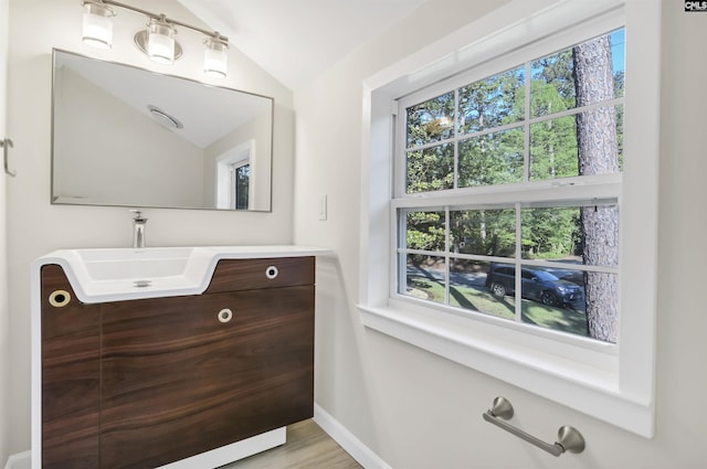15 Glenlake Rd, Columbia, SC 29223 - bathroom with vaulted ceiling, a sink, baseboards, and wood finished floors