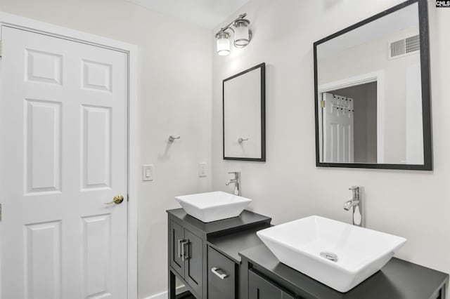 15 Glenlake Rd, Columbia, SC 29223 - bathroom with double vanity, visible vents, and a sink