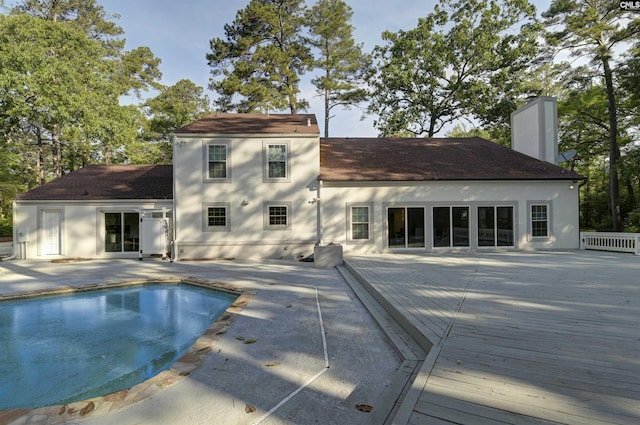 15 Glenlake Rd, Columbia, SC 29223 - rear view of property with a patio area, roof with shingles, a chimney, and an outdoor pool