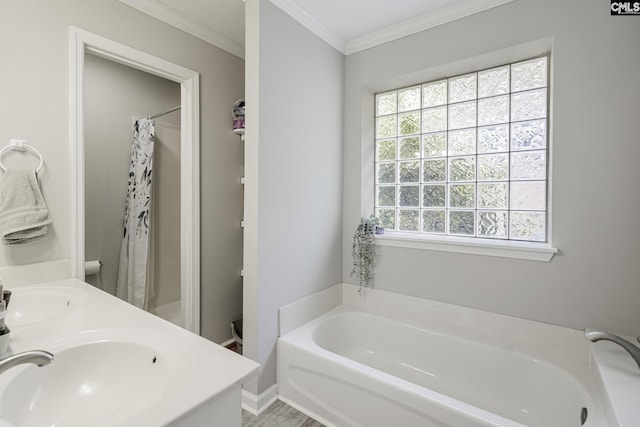 full bath with a sink, curtained shower, ornamental molding, and a bath