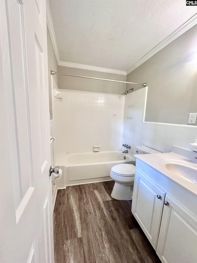 full bathroom with crown molding, a textured ceiling, and wood finished floors