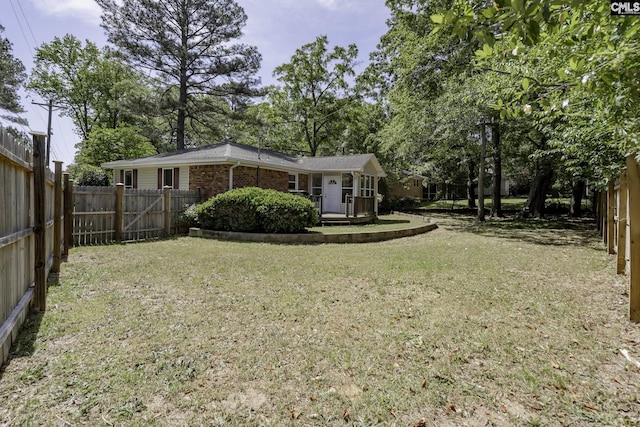 view of yard with a fenced backyard