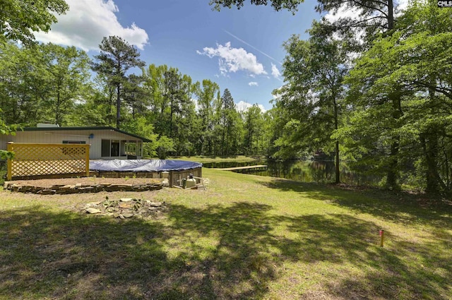 view of yard featuring a deck with water view