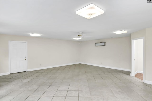 basement with baseboards and ceiling fan