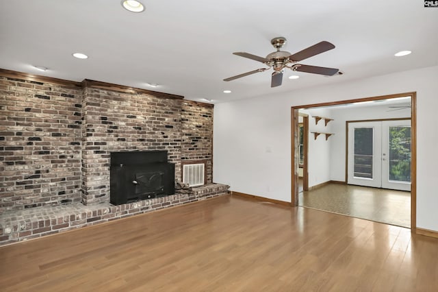 unfurnished living room featuring wood finished floors, visible vents, baseboards, and recessed lighting