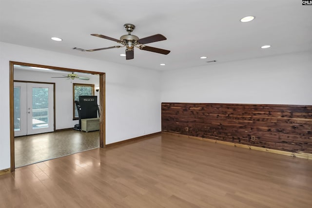 unfurnished room with wood finished floors, baseboards, ceiling fan, and recessed lighting