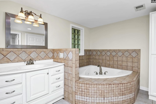 bathroom featuring a garden tub, visible vents, tile patterned flooring, and vanity