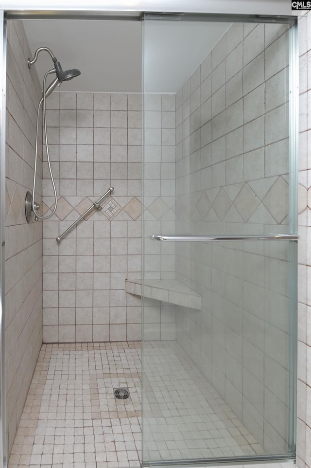 full bathroom featuring a shower stall