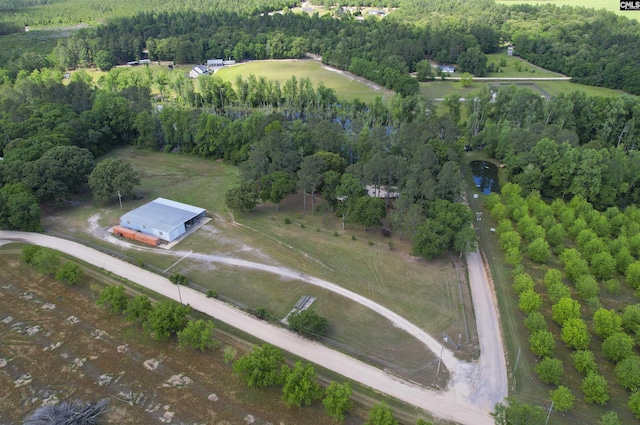 aerial view with a rural view and a wooded view