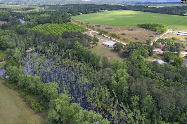 birds eye view of property featuring a wooded view