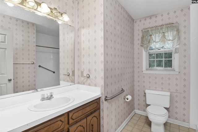 full bath with wallpapered walls, toilet, baseboards, and vanity