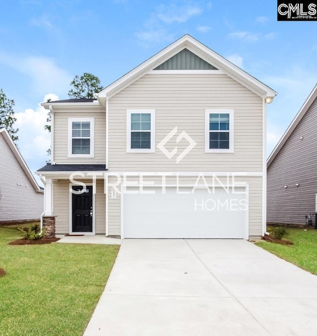 view of front of home featuring driveway, a front yard, and a garage