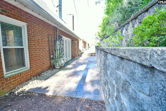 view of side of property with brick siding
