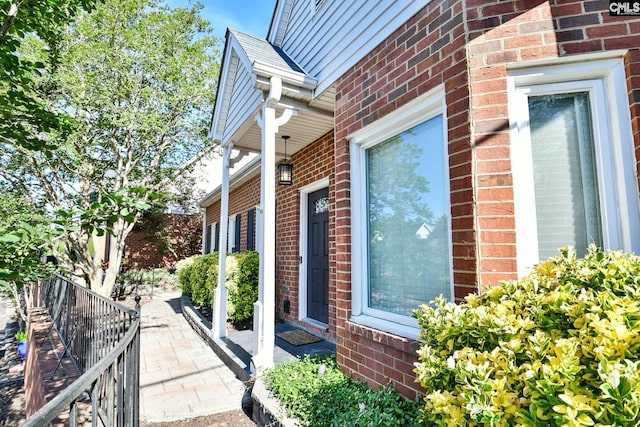view of property exterior with brick siding